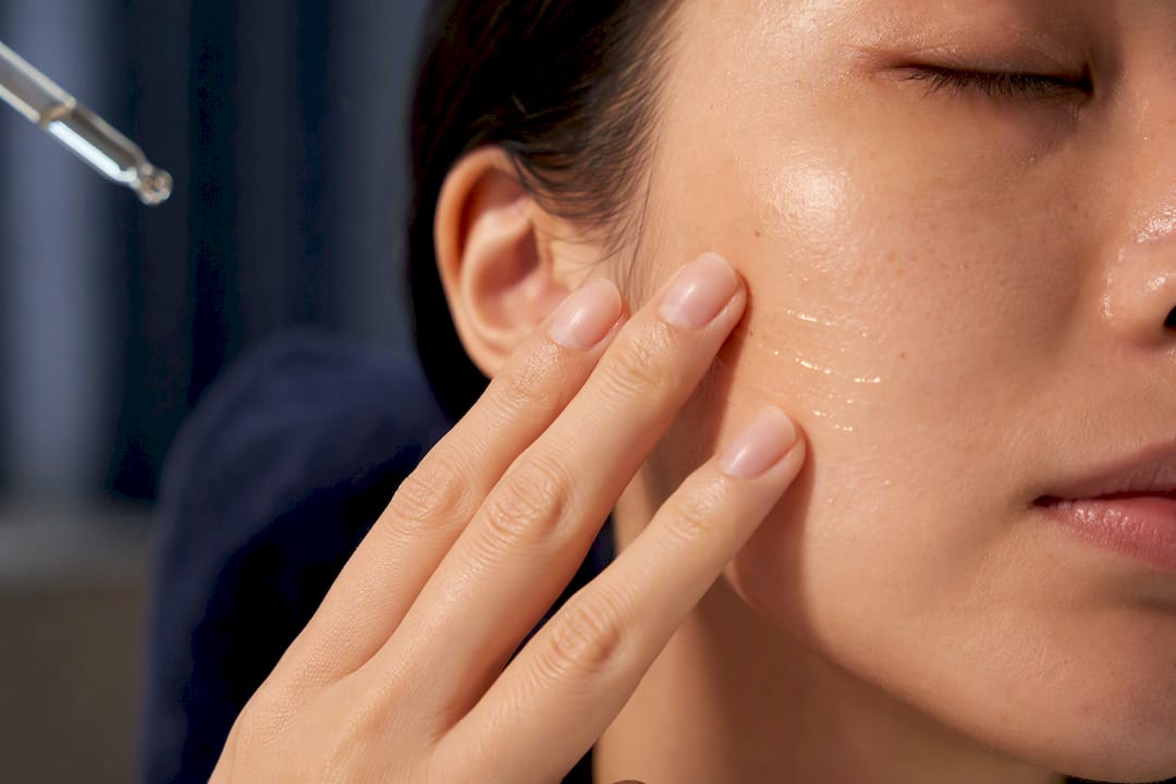 Serum being applied to facial skin